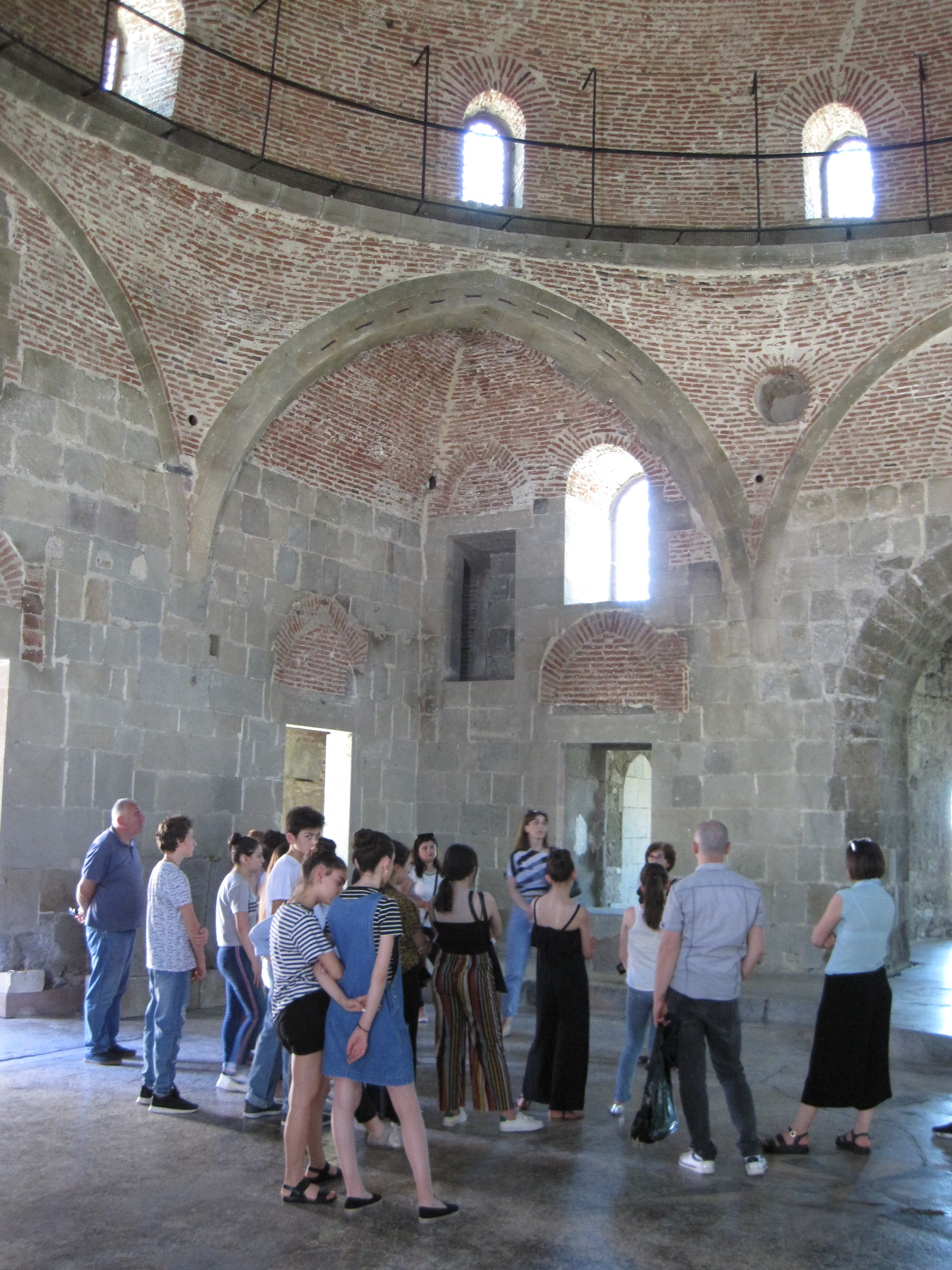 Interior of Rabati Castle mosque, with group of tourists.