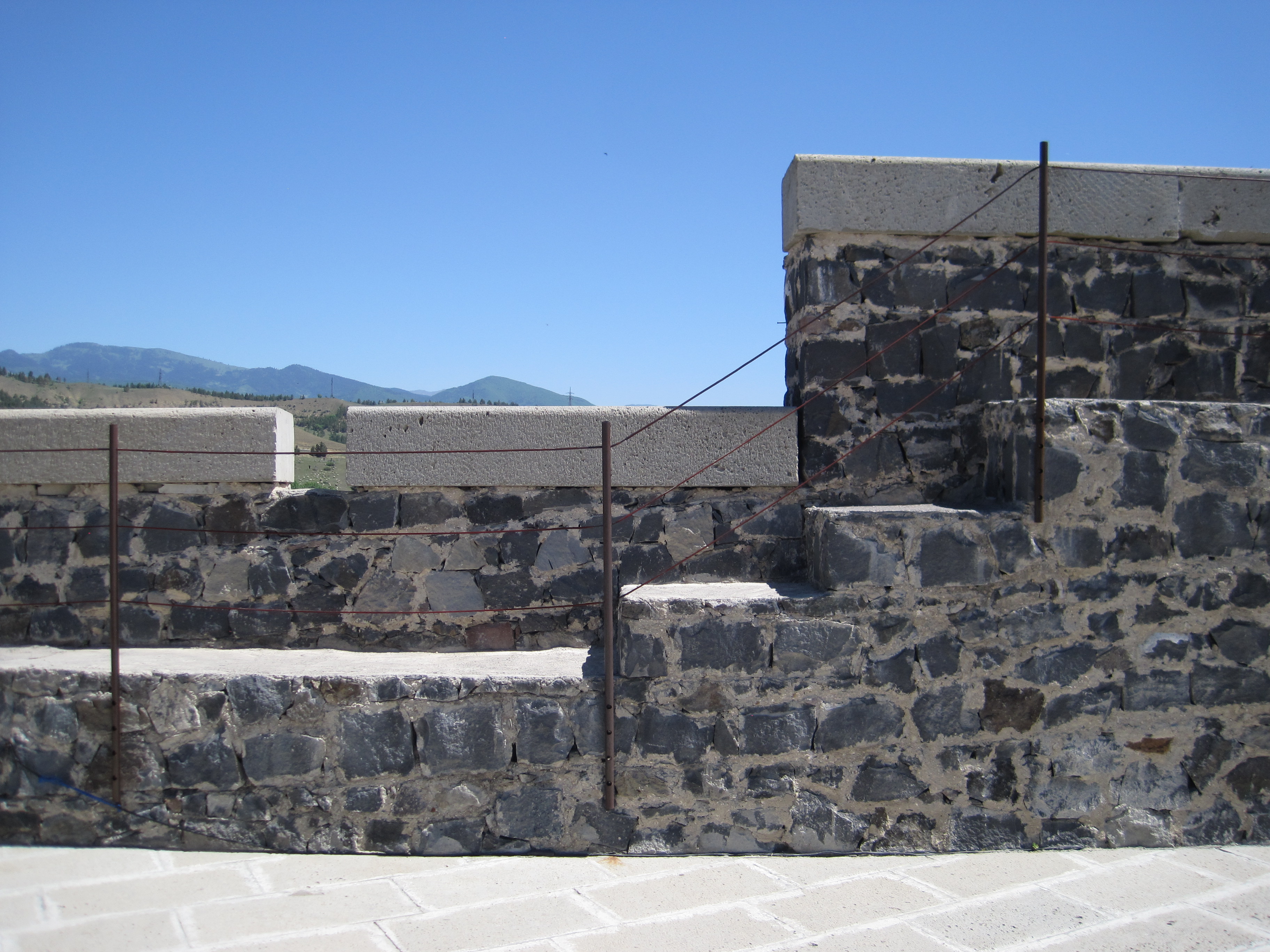 Stone wall of Rabati Castle, with concrete blocks on top.