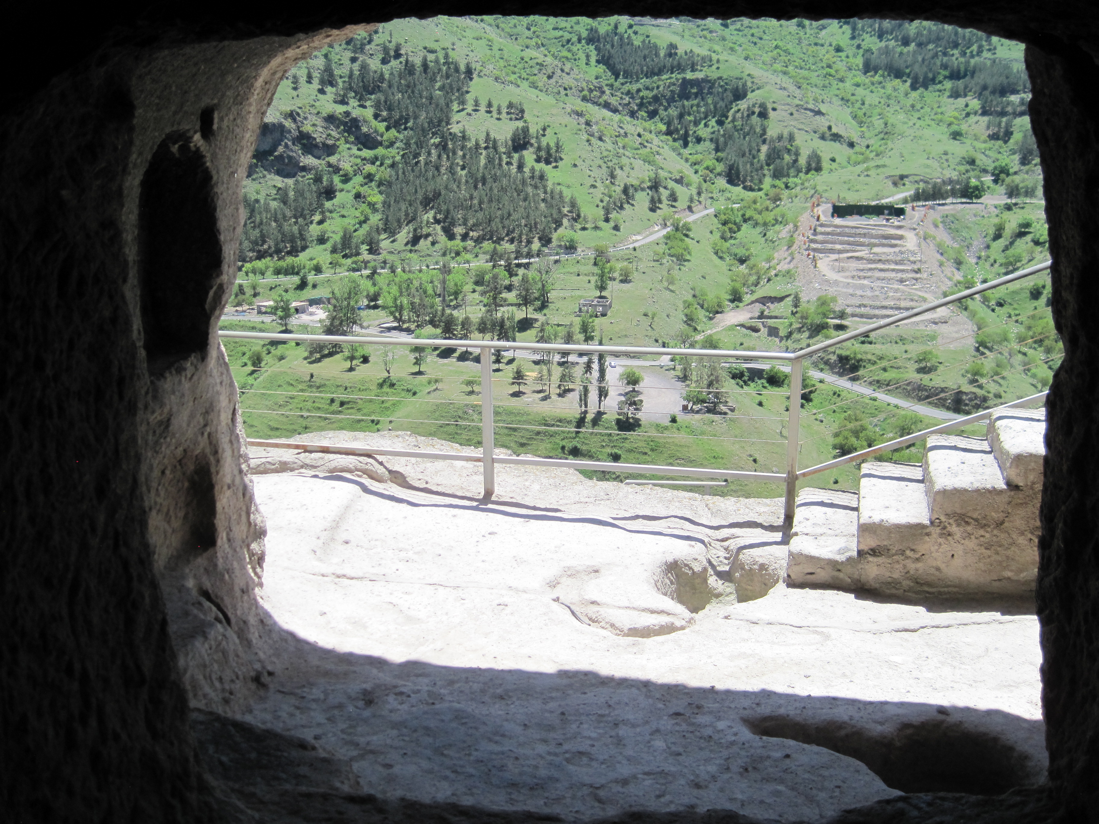 View of the far side of the valley, framed by a cave entrance.