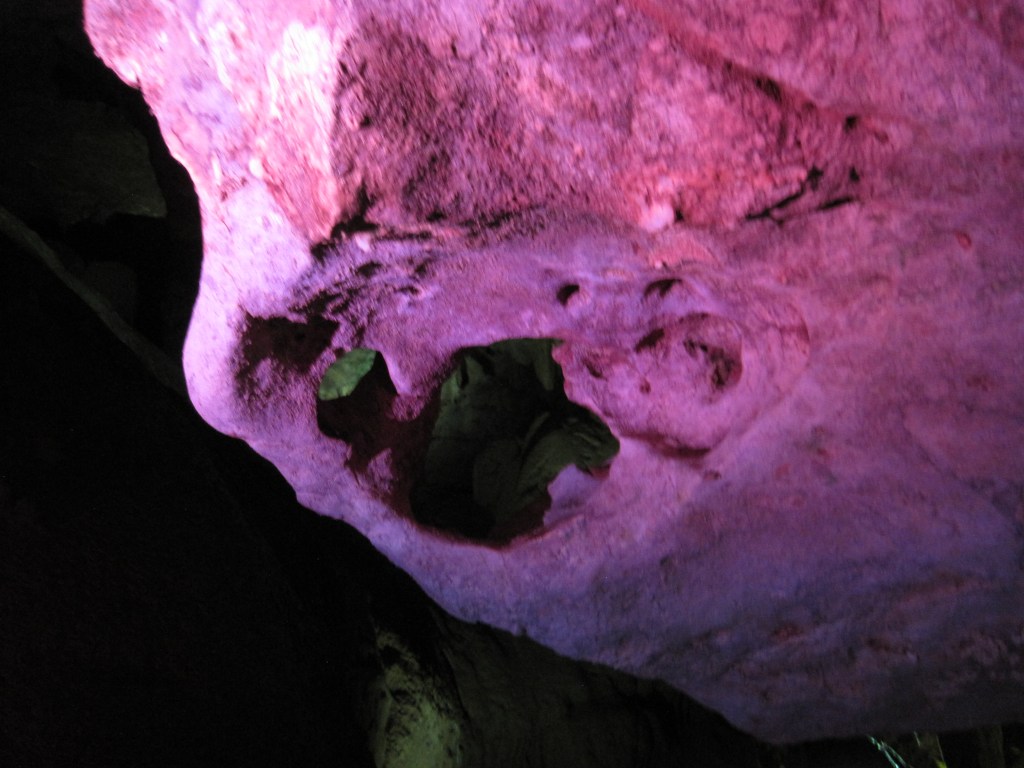 A rock formation with a hole through it.