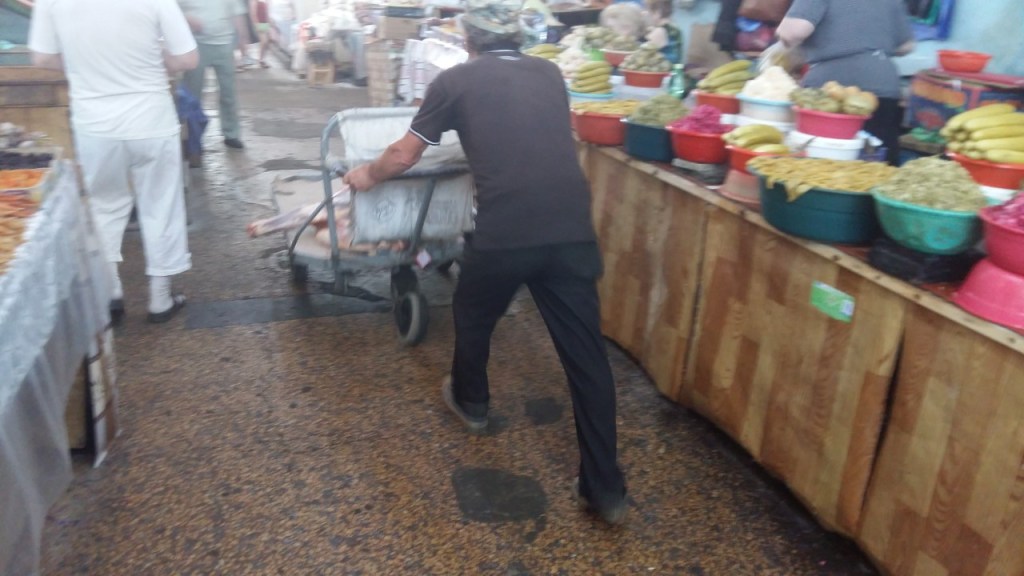 A haunch of beef on a handcart pushed through the Green Bazaar, Kutaisi